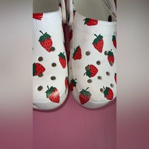 Woman’s strawberry crocs
